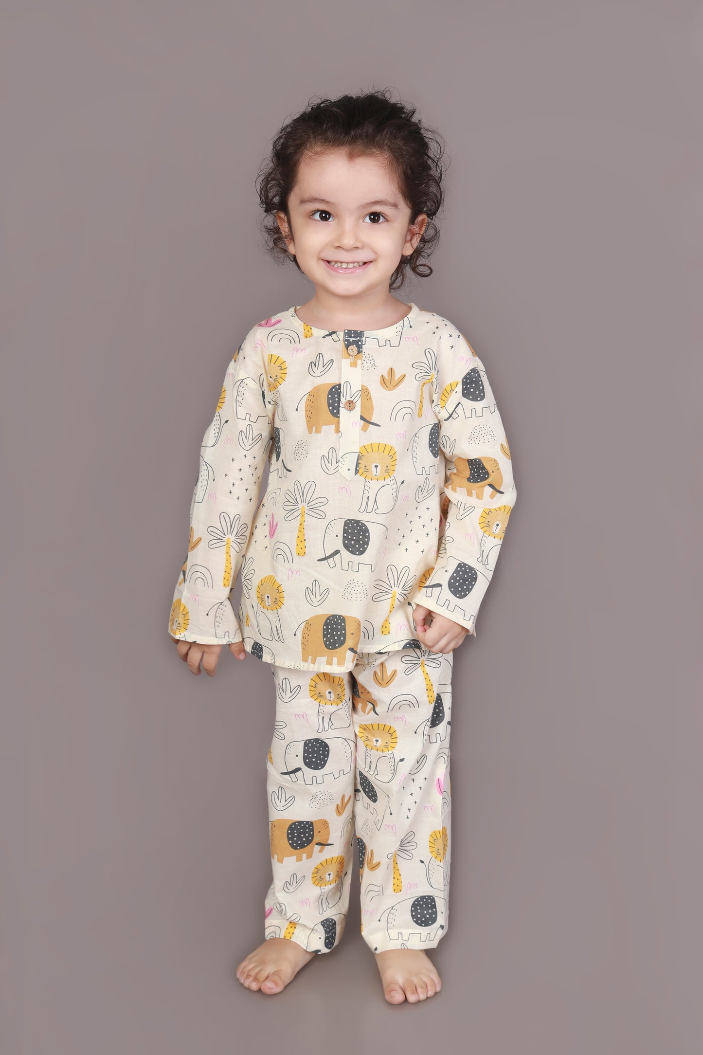 Child wearing kurta pajamas set with animal prints