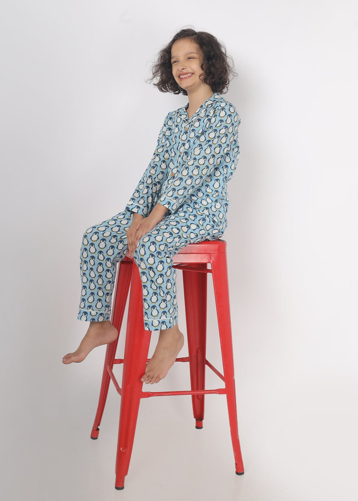 Kids blue cotton shirt and pant co-ord set with penguin print, full sleeves, notched collar, loose fit, soft and comfortable nightwear.
