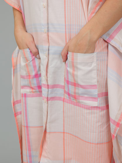 Person holding a pink and white checkered fabric