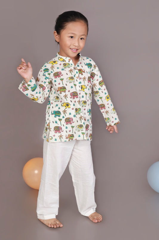 Child wearing a colorful elephant animal patterned Kurta and white pants 