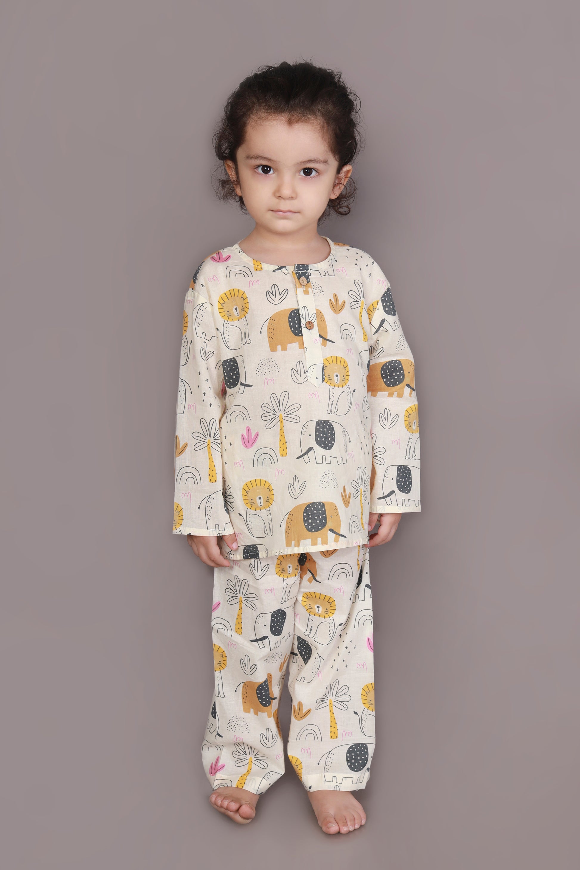 Child wearing kurta pajamas set with animal prints