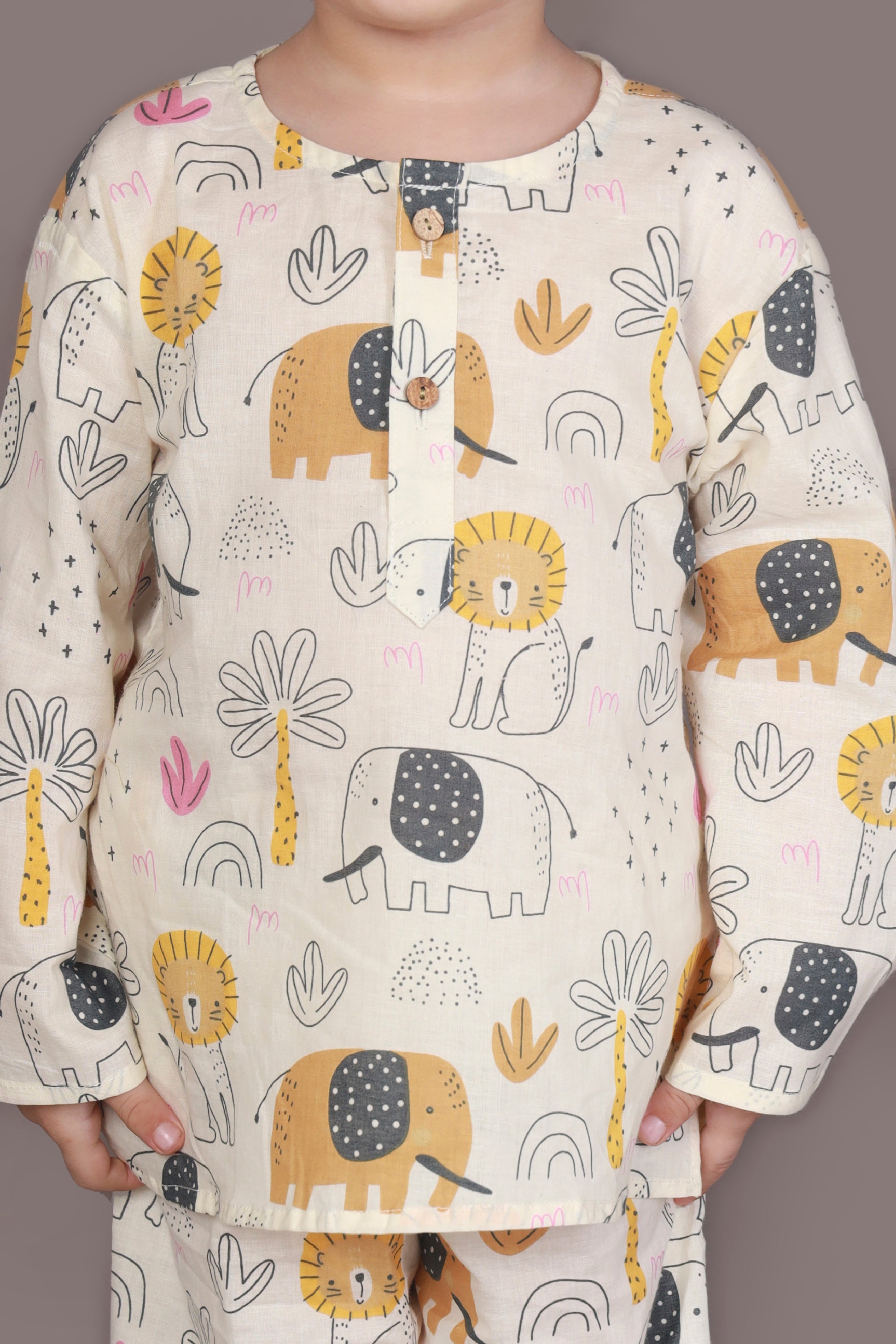 Child wearing kurta pajamas set with animal prints