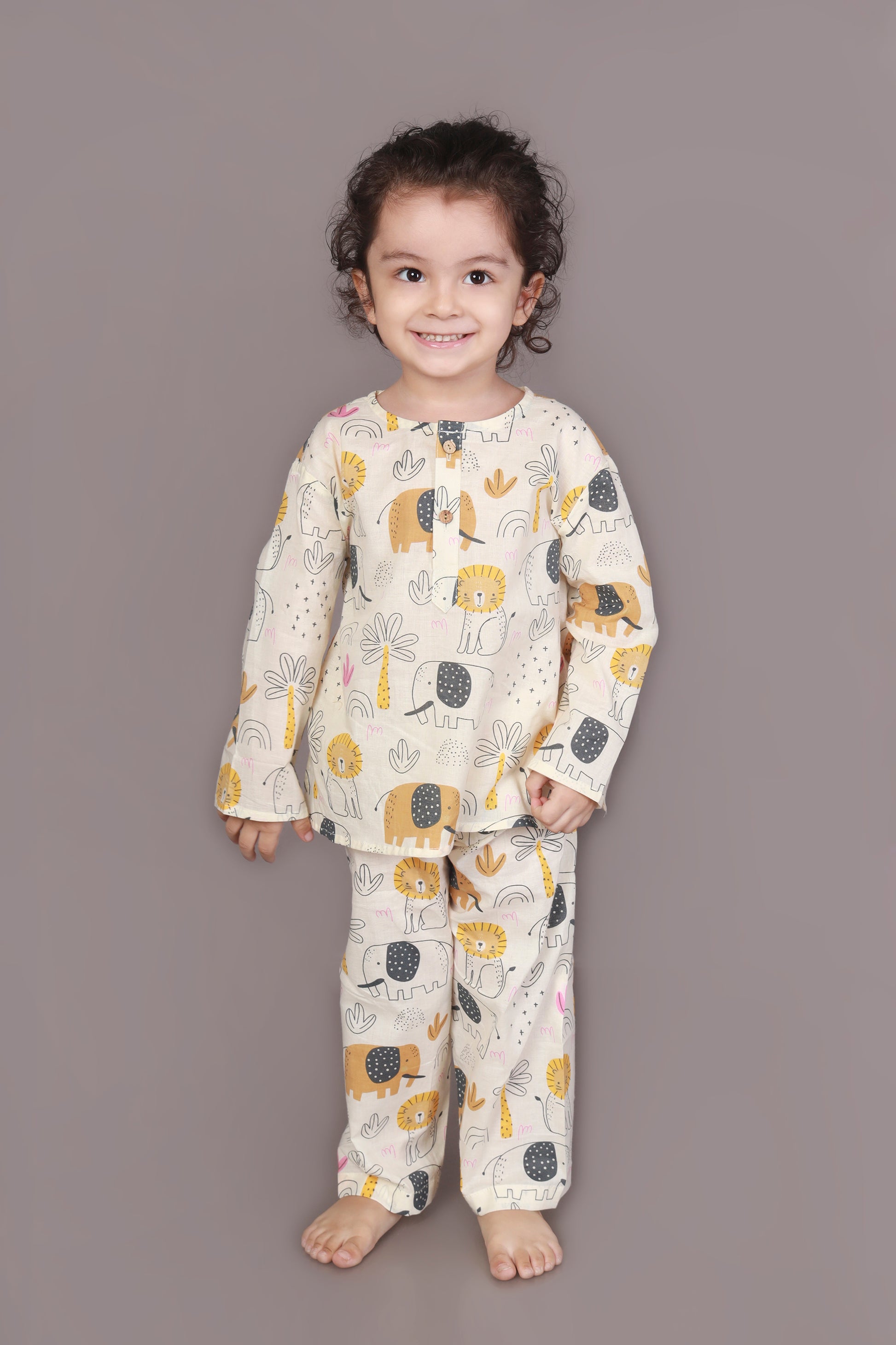 Child wearing kurta pajamas set with animal prints