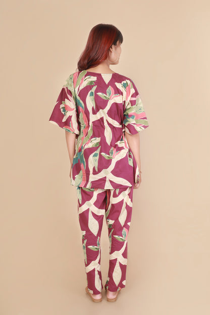Woman wearing a floral outfit on a beige background