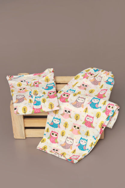 Child wearing a colorful owl patterned kurta pajama set 