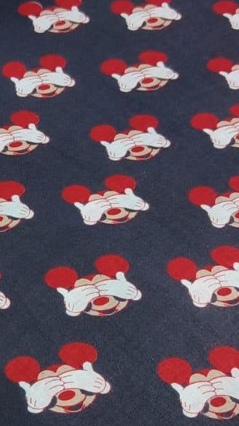Folded fabric with cartoon character pattern on a white background