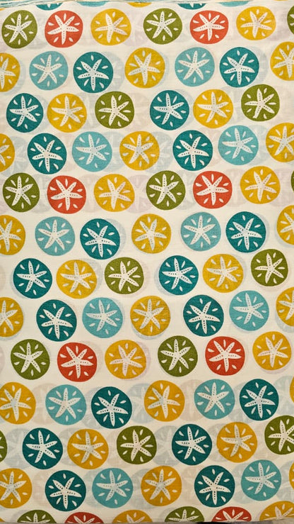 Colorful patterned box with geometric shapes on a neutral background