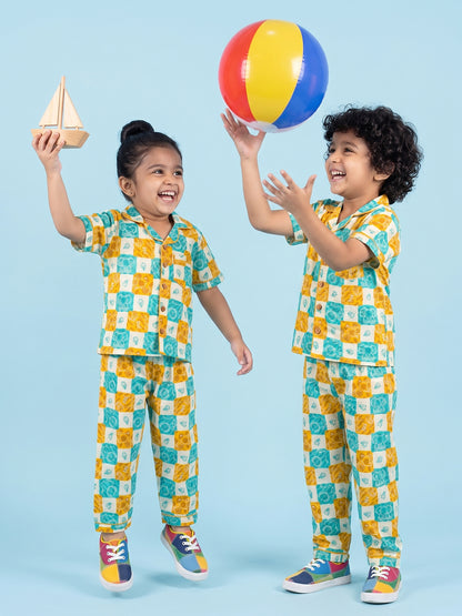 Kids Playing in checkered nighsuit pajama set