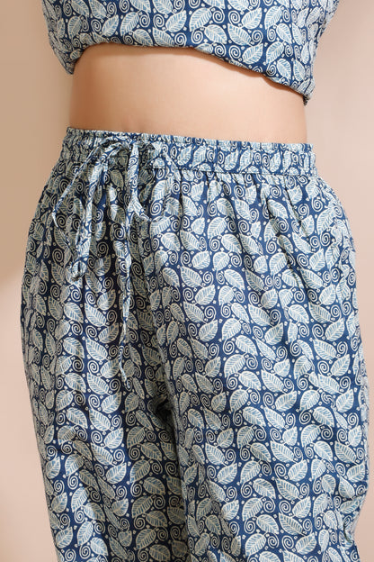 Blue and white patterned pants with a beige background
