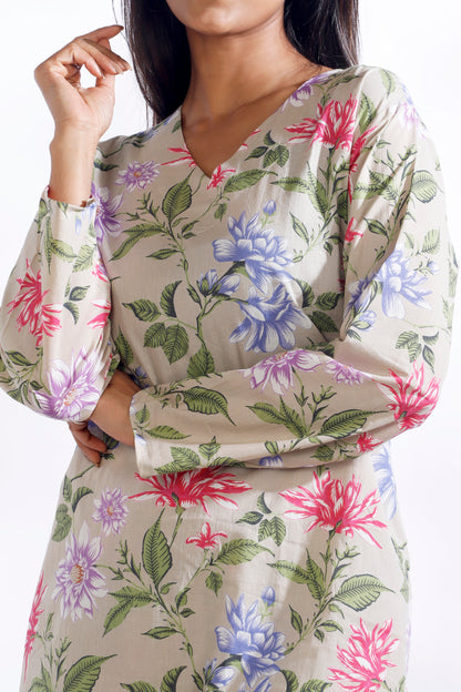 Floral patterned dress with long sleeves on a white background