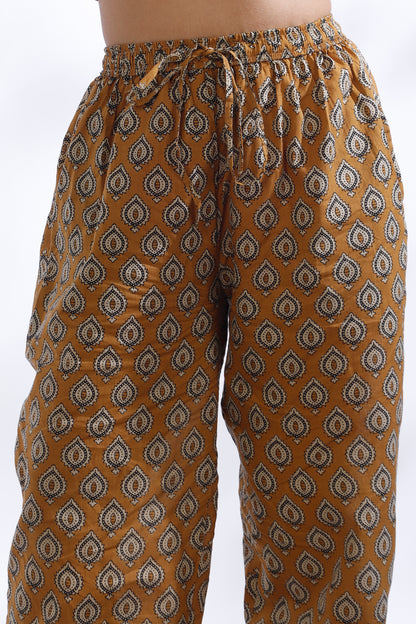 Brown patterned pants on a white background