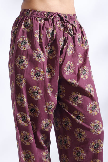 Purple patterned pants on a white background