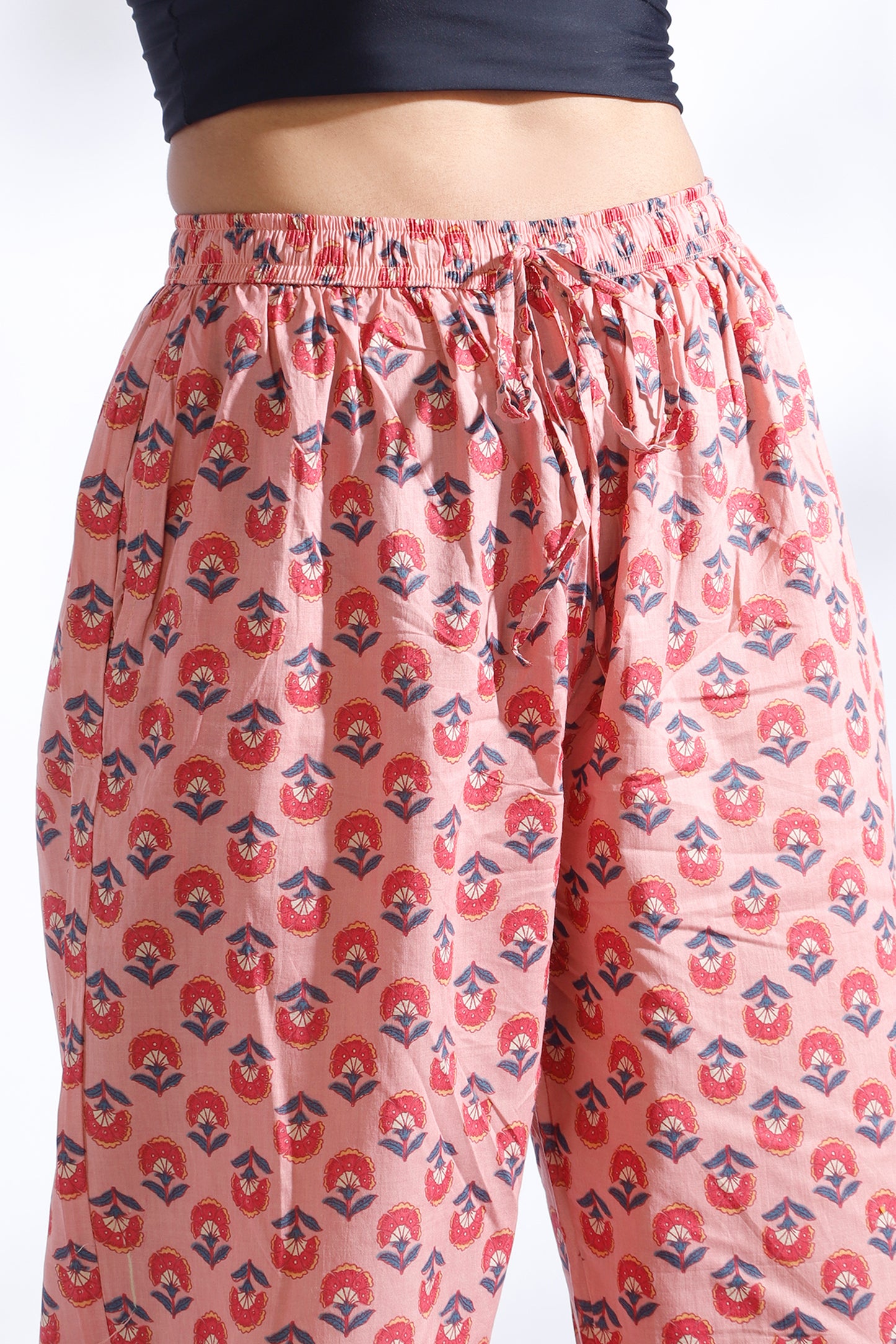 Floral patterned pants on a plain background