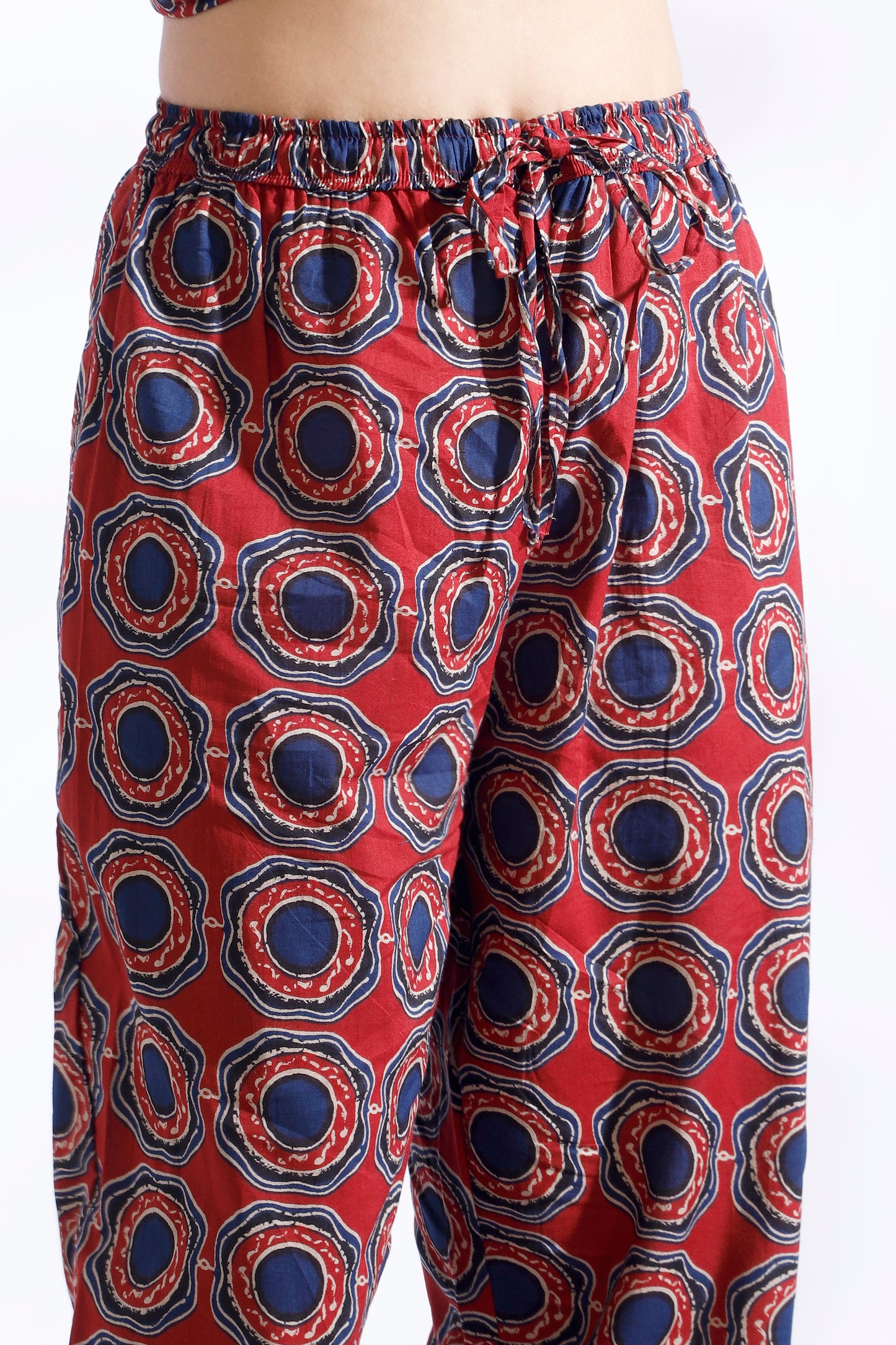 Red patterned pants on a white background