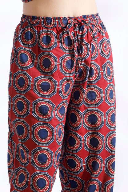 Red patterned pants on a white background