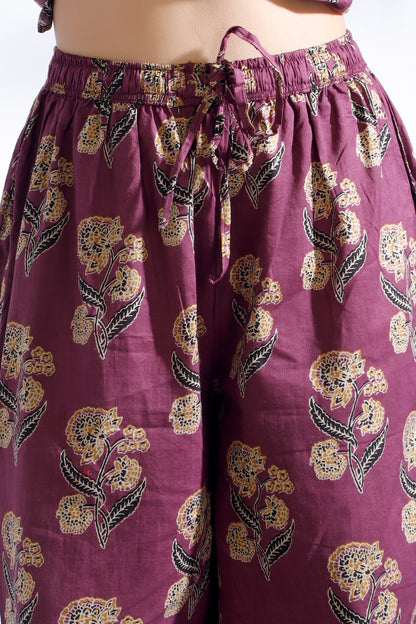 Purple floral-patterned pants on a white background