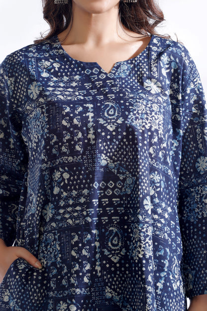 Blue patterned shirt worn by a person on a white background