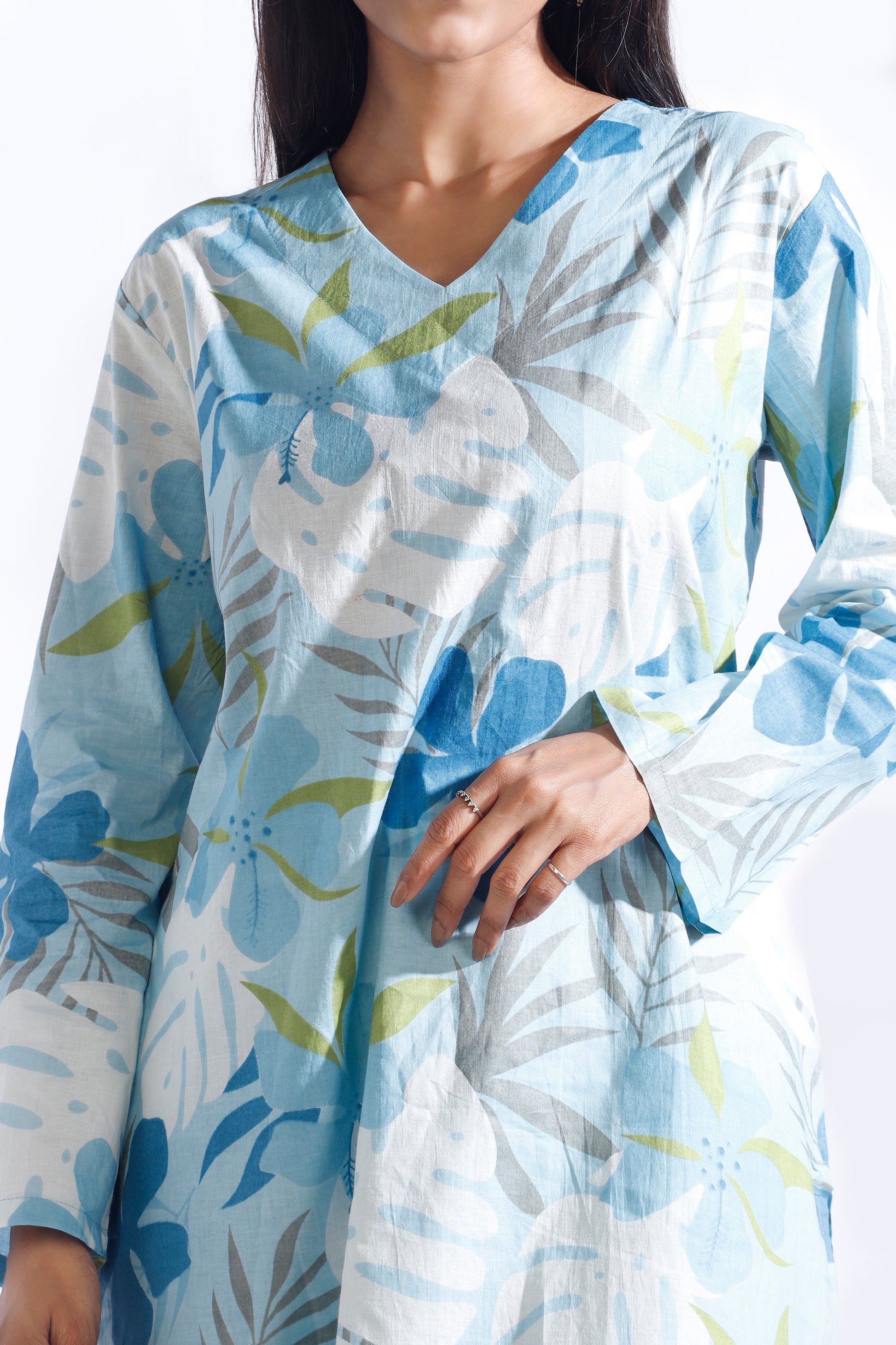 Light blue and white floral patterned dress worn by a person