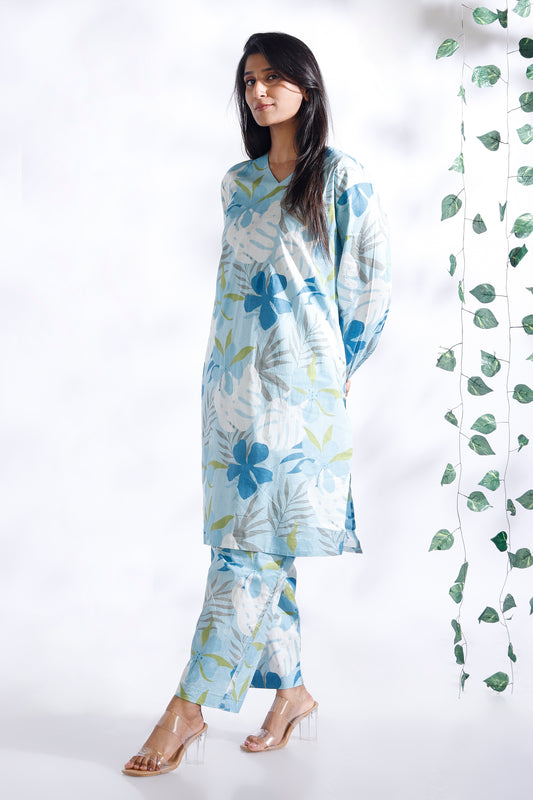 Woman wearing a floral outfit with a white background
